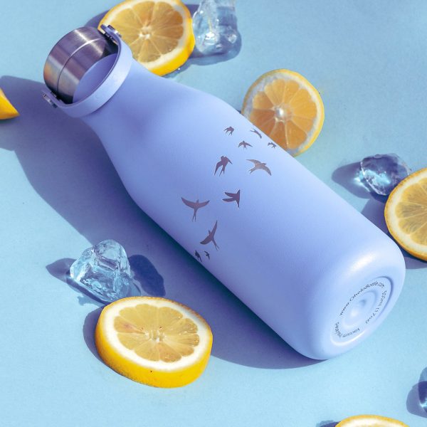 Ohelo blue swallow bottle, flatlay with lemon and icecubes