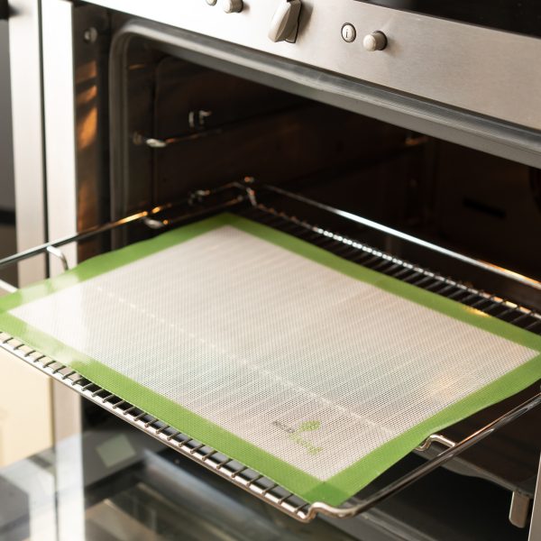 Reusable baking mat in oven